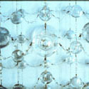 <i>Chandeliers #17,#18,#19</i>, 2000, installation view. Yarra Sculpture Space. glass, embroidery looms, fishing tackle, photographs, watercolour, printed lenses, crystal beads, printed chiffon, magnifying glass. Dimensions variable