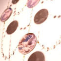 <i>Dreamscape</i>, Chandelier detail, 1999-2000, installation view. Ian Potter Museum of Art. glass, embroidery looms, fishing tackle, photographs, watercolour, printed lenses, crystal beads, printed chiffon. Dimensions variable