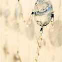 <i>Dreamscape</i>, Chandelier detail, 1999-2000, installation view. Ian Potter Museum of Art. glass, embroidery looms, fishing tackle, photographs, watercolour, printed lenses, crystal beads, printed chiffon. Dimensions variable