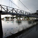<i>Nestings</i>, 2011 Lorne Sculpture Prize. Recycled plastic, water, glass rocks, steel cable. Dimensions variable- 50mt span across bridge