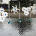<i>Nestings</i>, 2011 Lorne Sculpture Prize. Recycled plastic, water, glass rocks, steel cable. Dimensions variable- 50mt span across bridge 